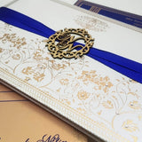 White, Gold & Blue Color Custom Handcrafted Hardbound Padded Invitation with Satin Ribbon & Laser-cut Wooden Emblem: T5-019